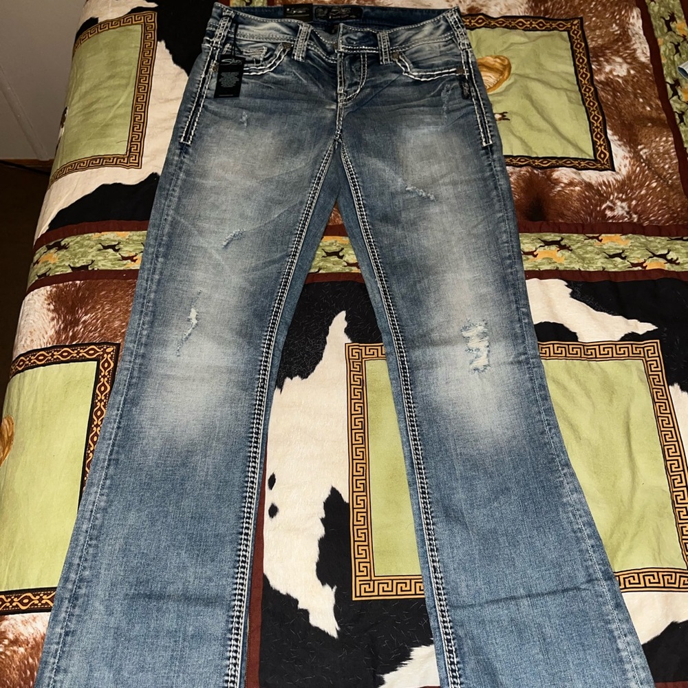 Brand new pair of Silver Aiko bootcut jeans